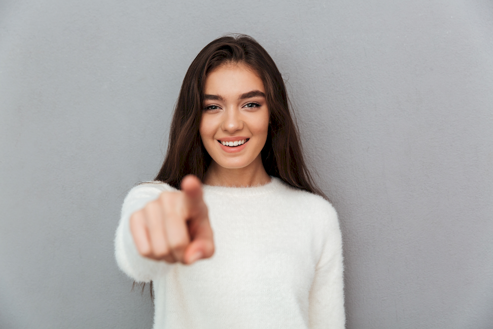 cheerful-attractive-girl-white-fluffy-pullover-pointing-with-finger-you_2